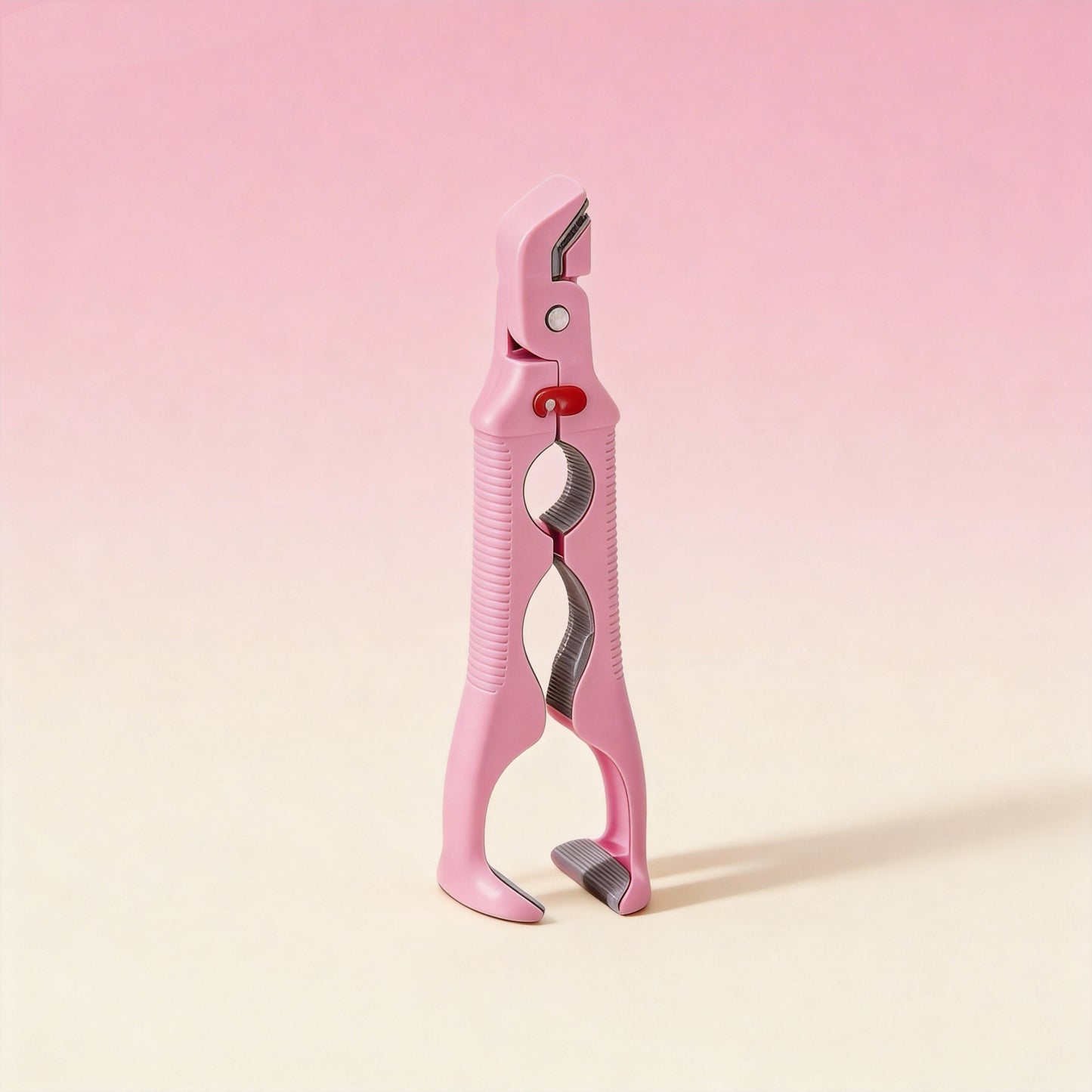 3-in-1 silicone kitchen gripper in Pink gripping a hot bowl